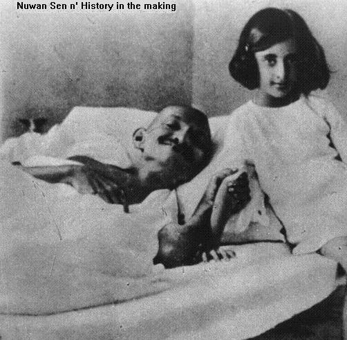 Indira with her father's mentor Mahatma Gandhi during his fast in 1924