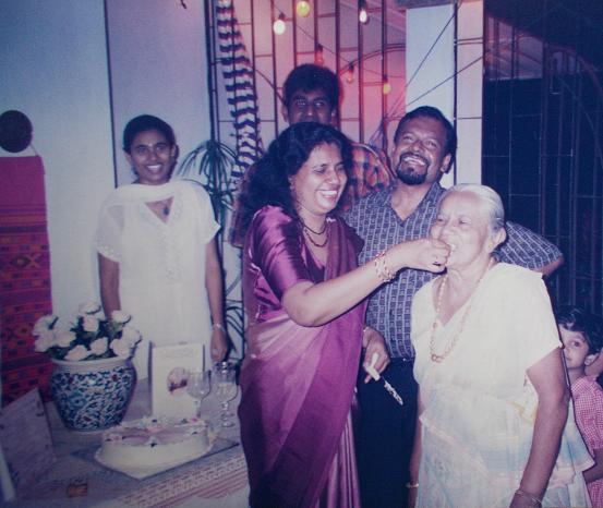 At my mum's 50th Birthday party, at mums (@ 56, Siripura). Sachi & I, seen in the background. My parents & my grandmother in the foreground. Behind Attammi, is her youngest grandchild (my youngest cousin, from my mother's side).  MAY 2009  