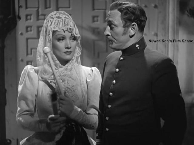 Marlene Dietrich and Lionel Atwill in a scene from the film.
